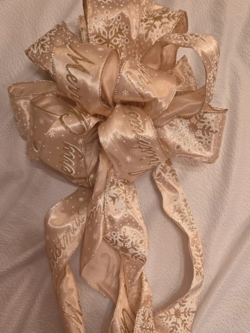 Festive Champagne Satin Holiday Bow with Gold Script and Snowflakes
